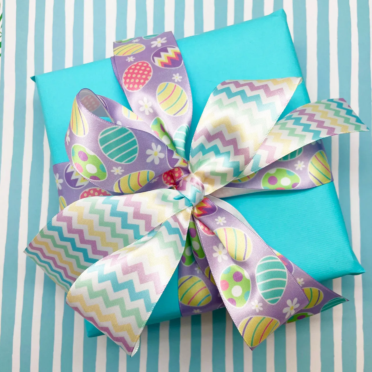 Easter ribbon Easter eggs in pastel colors printed on 1.5" white satin
