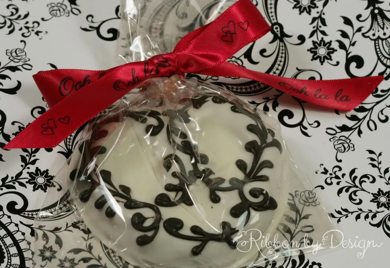 Ooh la la Ribbon with hearts in black on 5/8" bright red Single Face Satin Ribbon