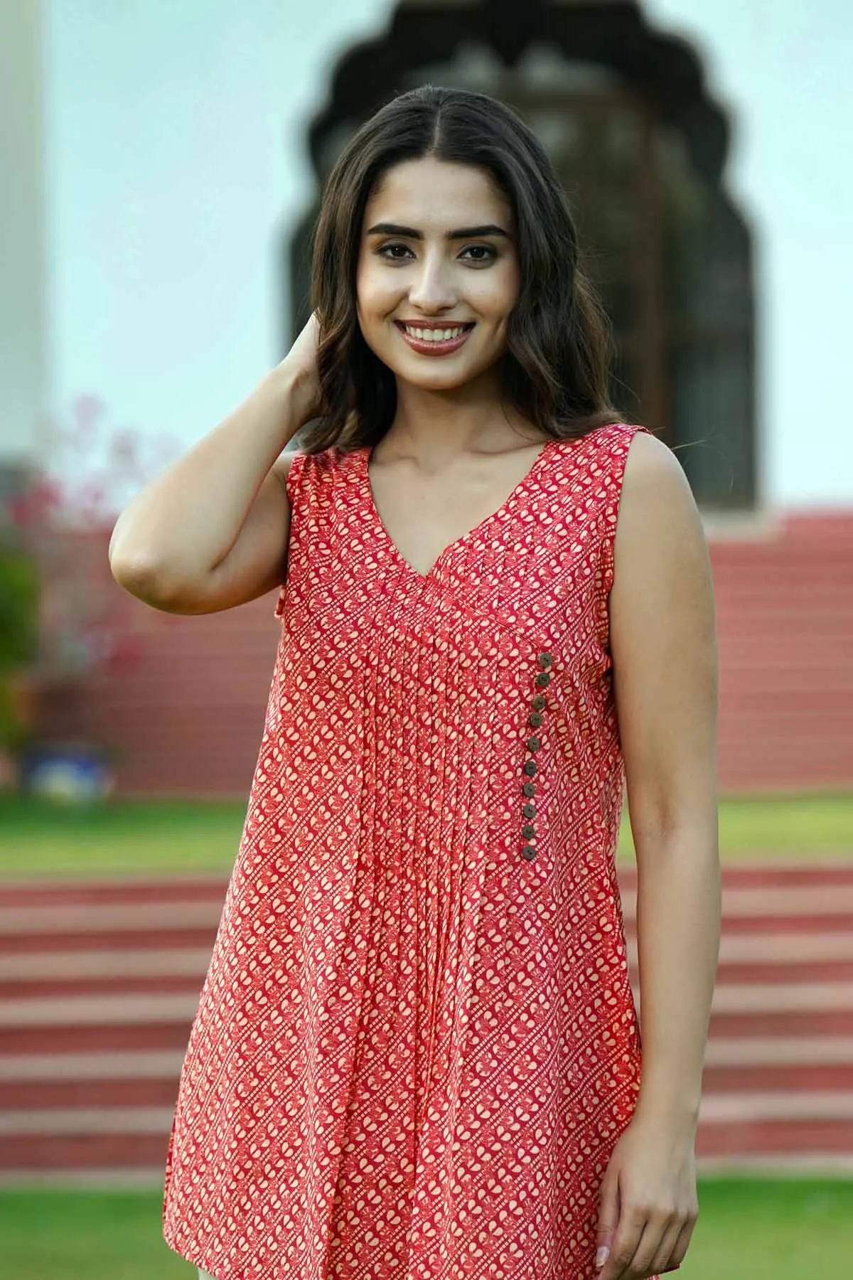 Sleeveless Short Length Kurti In Brick Red Color