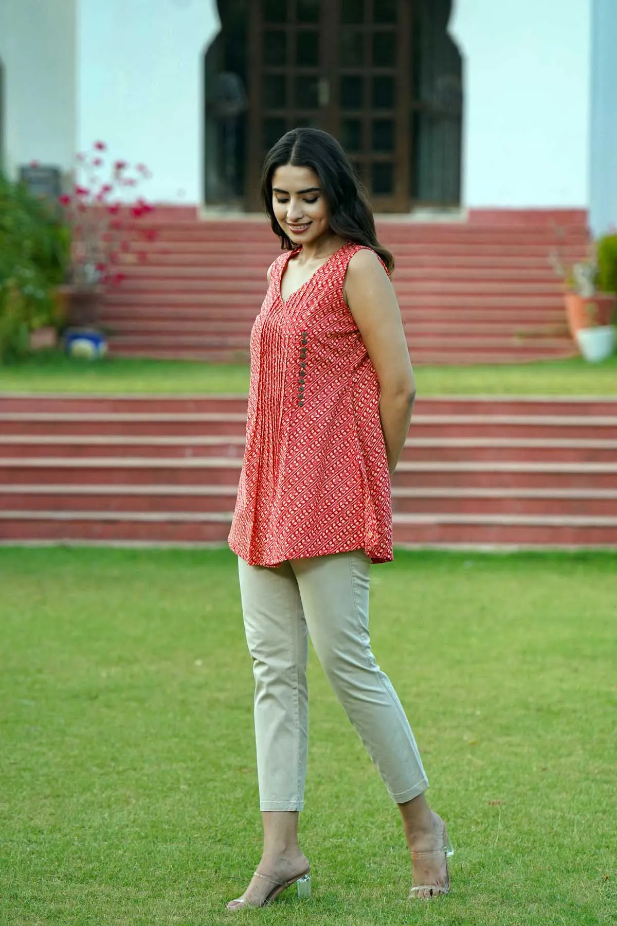 Sleeveless Short Length Kurti In Brick Red Color