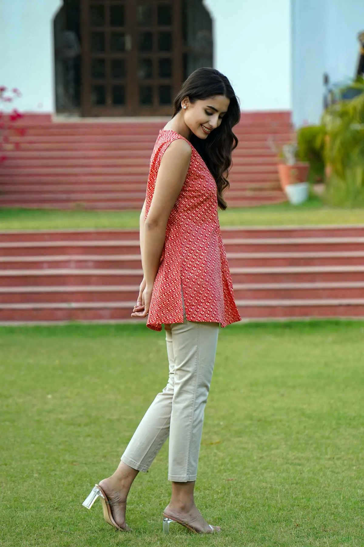 Sleeveless Short Length Kurti In Brick Red Color